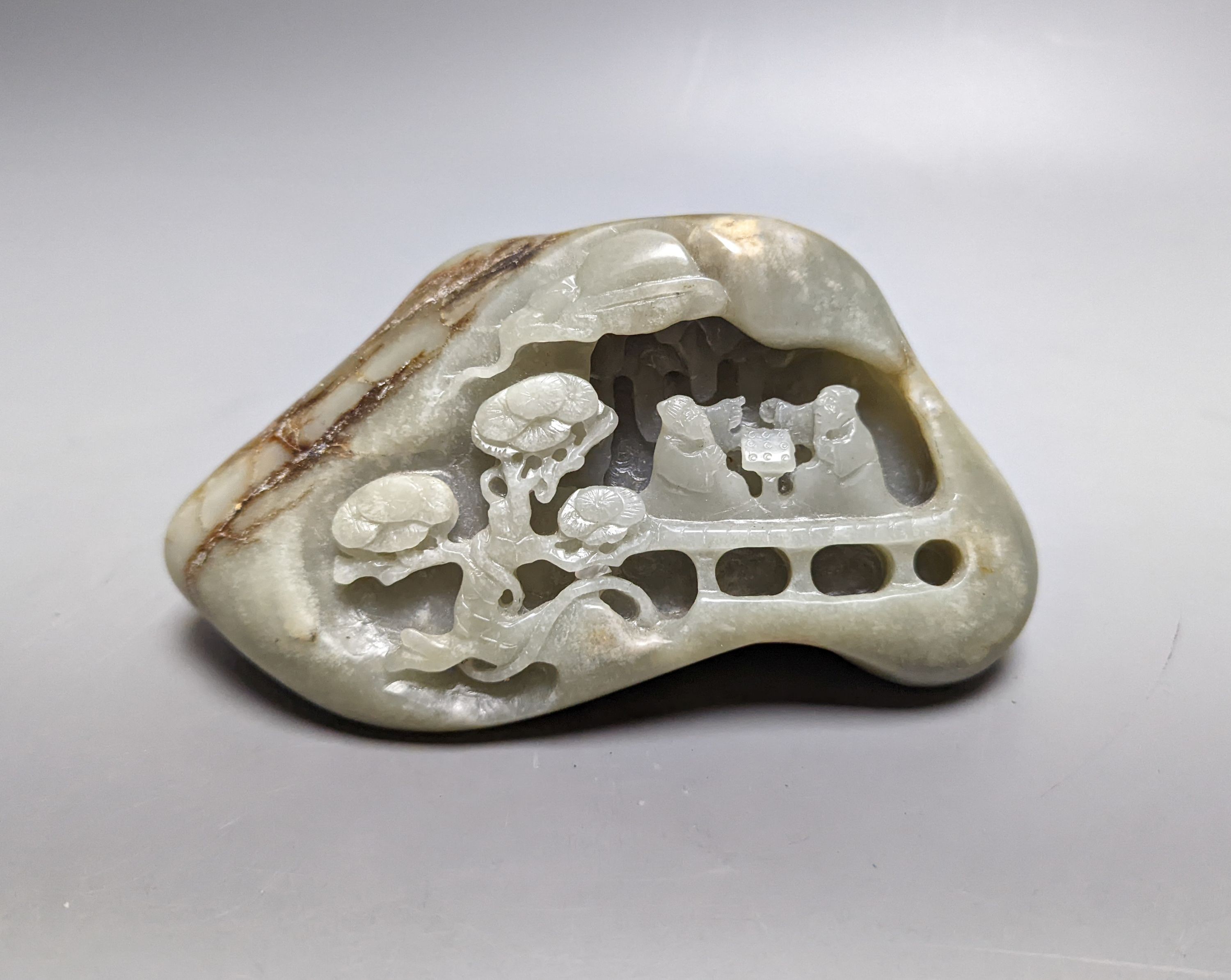 A Chinese celadon and russet jade boulder carving 16cm